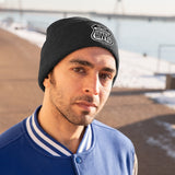 Man wearing black beanie with Scenic Hwys logo embroidered on front